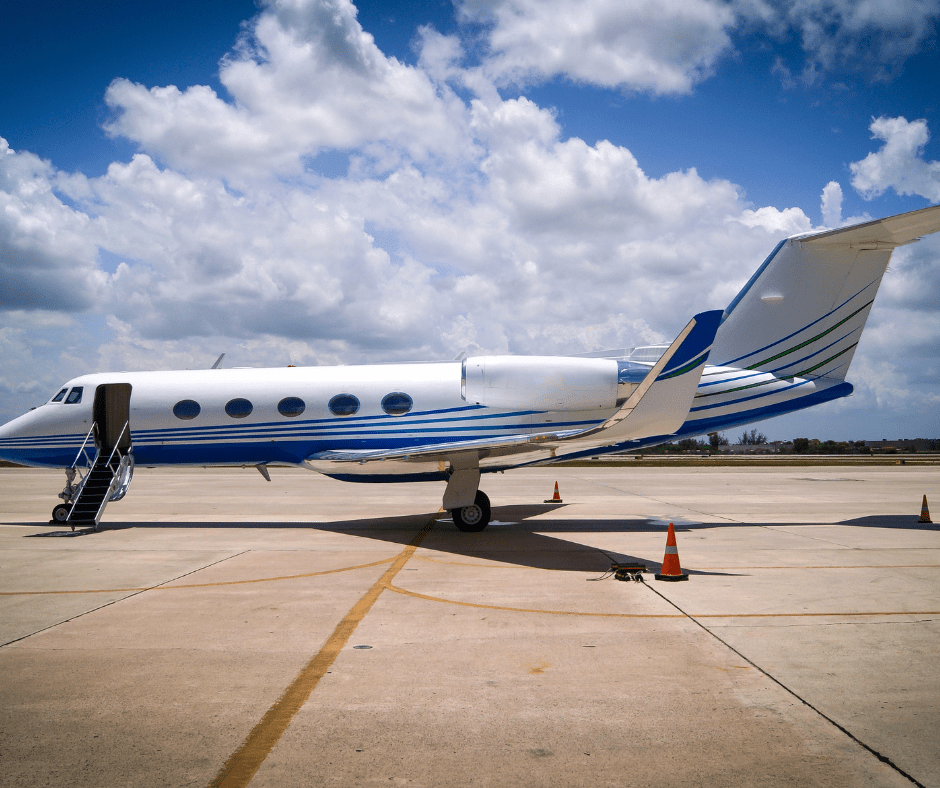 private jet with door open sitting on an airport tarmac